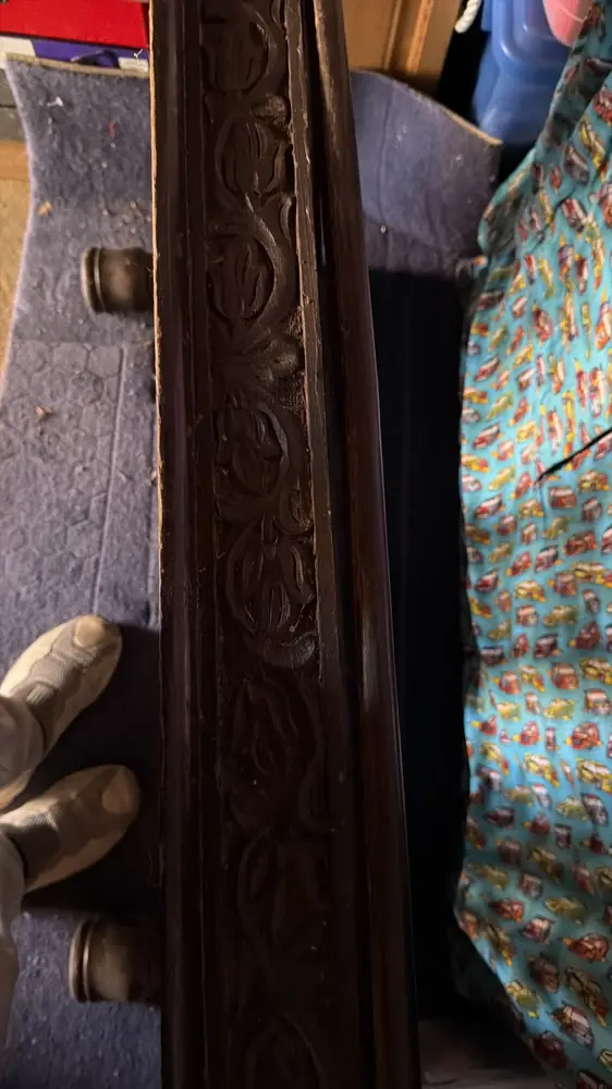 Carved antique furniture laid on blankets in the van