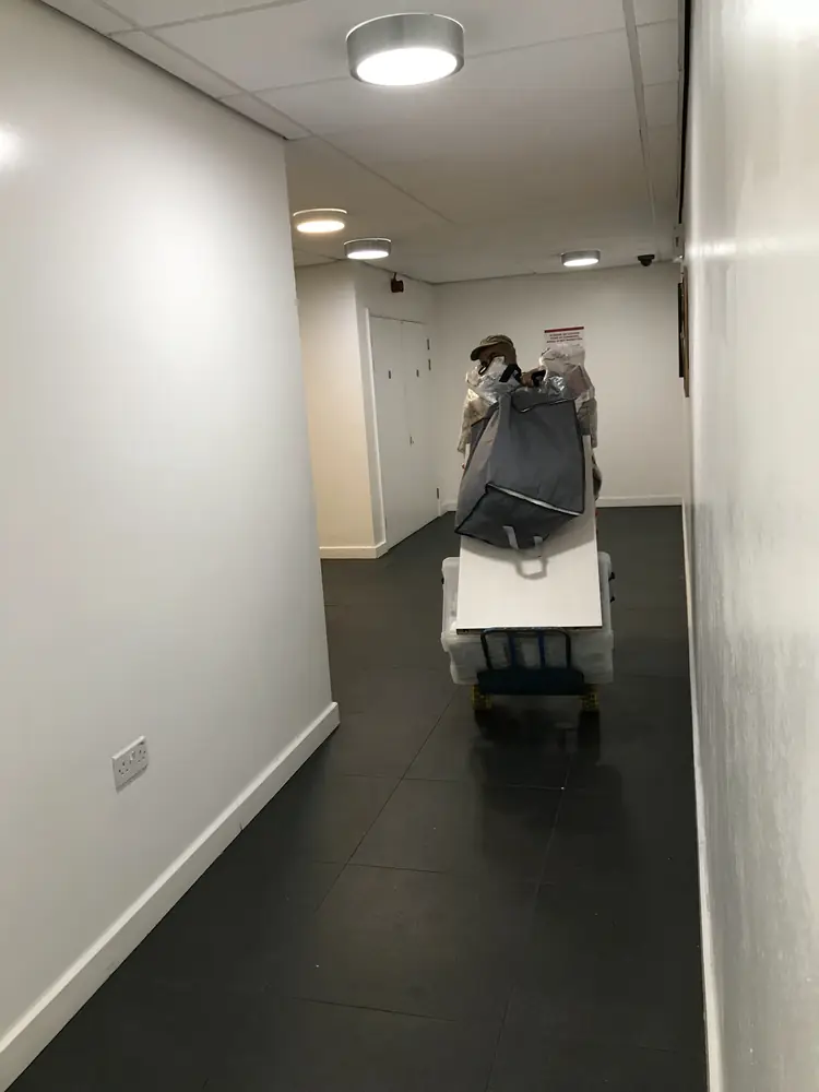 Moving a wrapped item along an apartment corridor