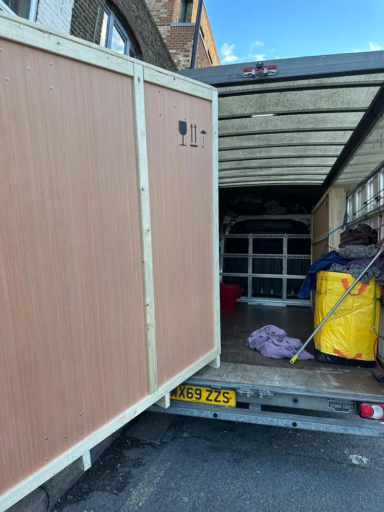 Large crated item loaded onto the Luton tail-lift