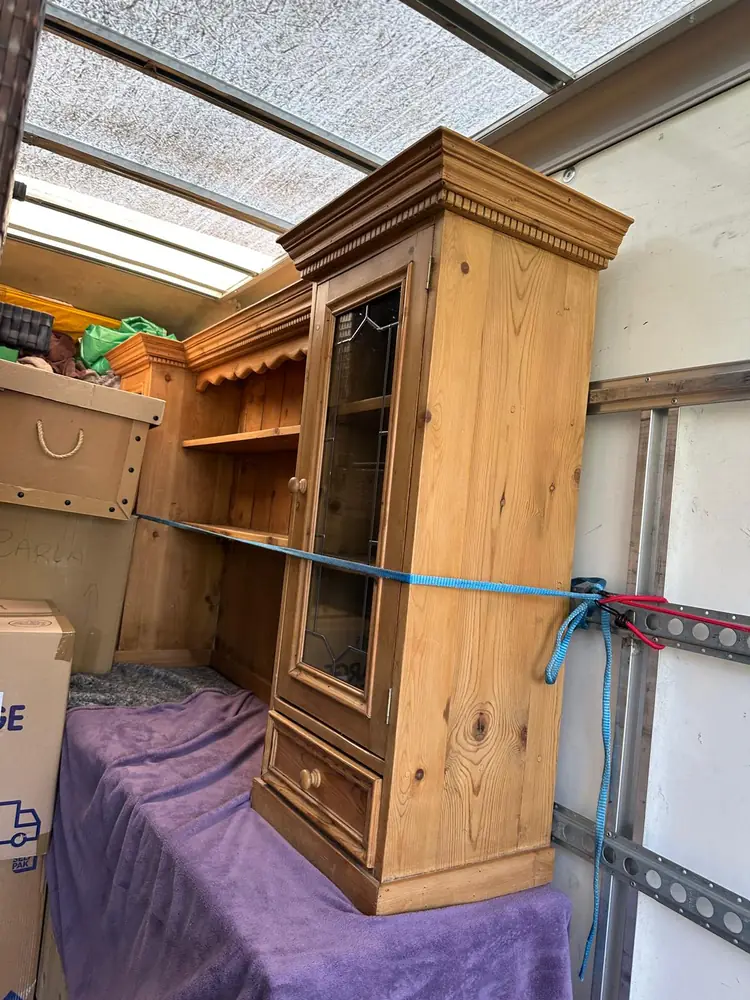 Pine dresser strapped in the Luton van