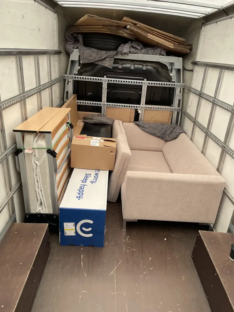 Sofa and boxes loaded in the Luton van