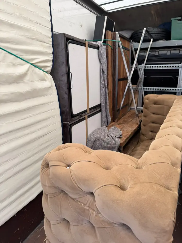Wrapped sofa and mattress strapped in the Luton