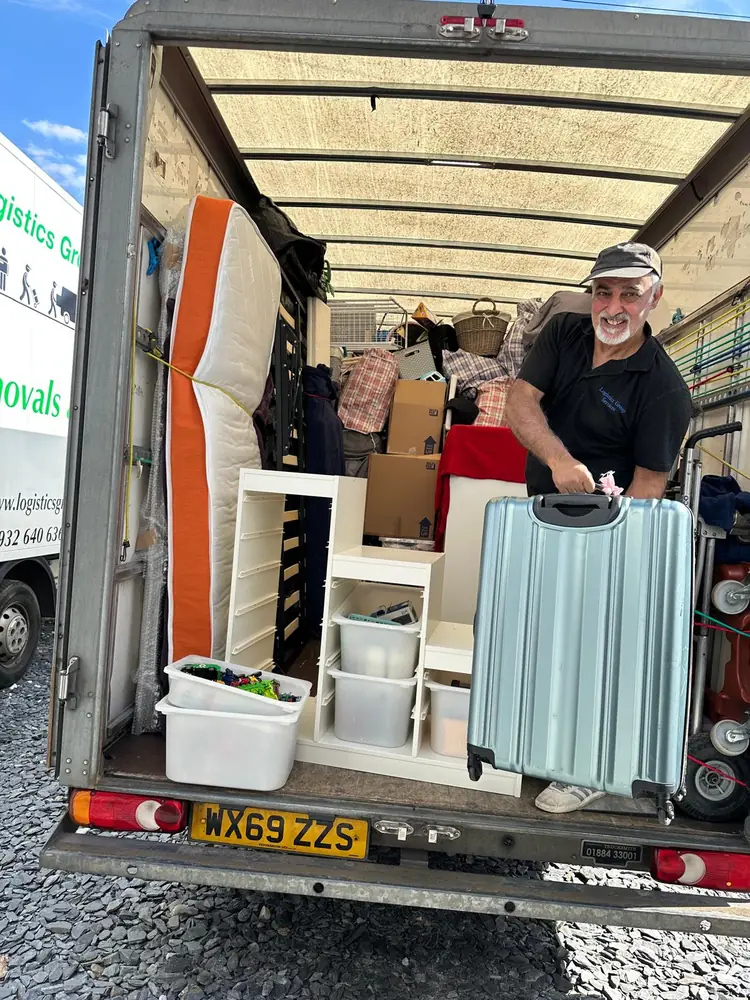Team in the loaded Luton van