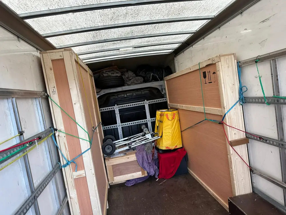 Wardrobe panels and boxes strapped in the Luton
