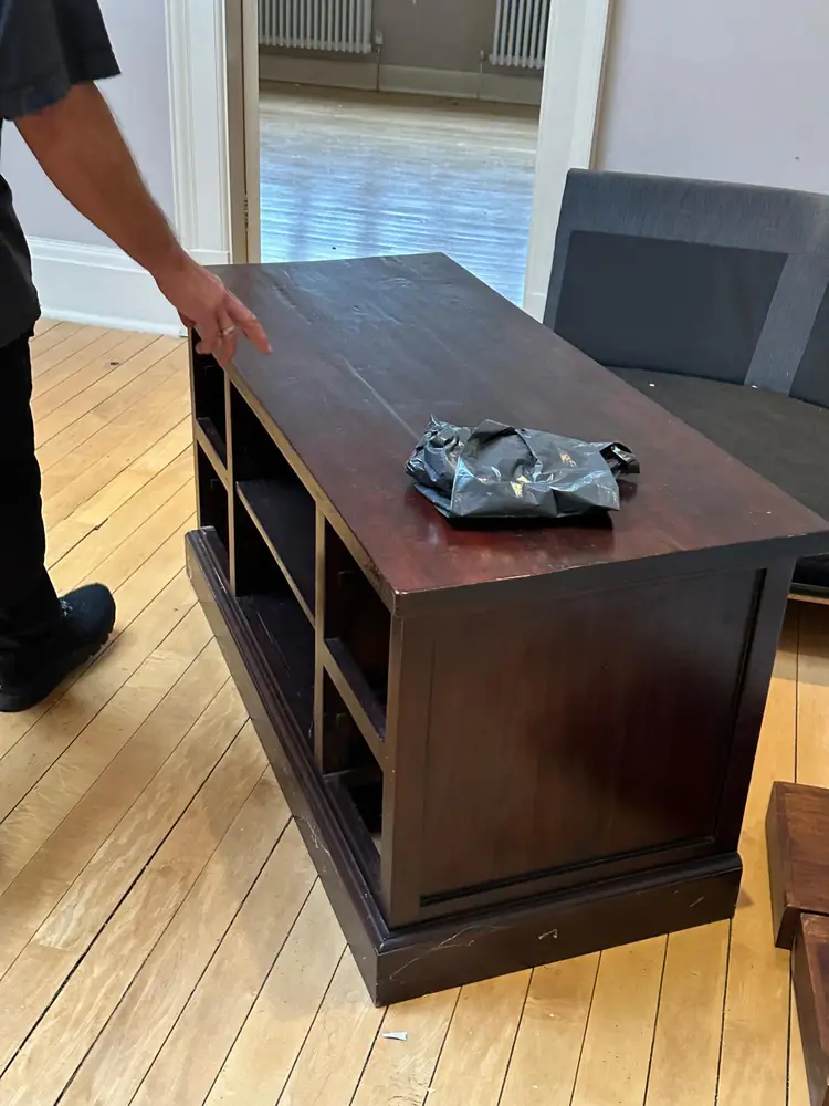 Carrying a TV unit through the flat