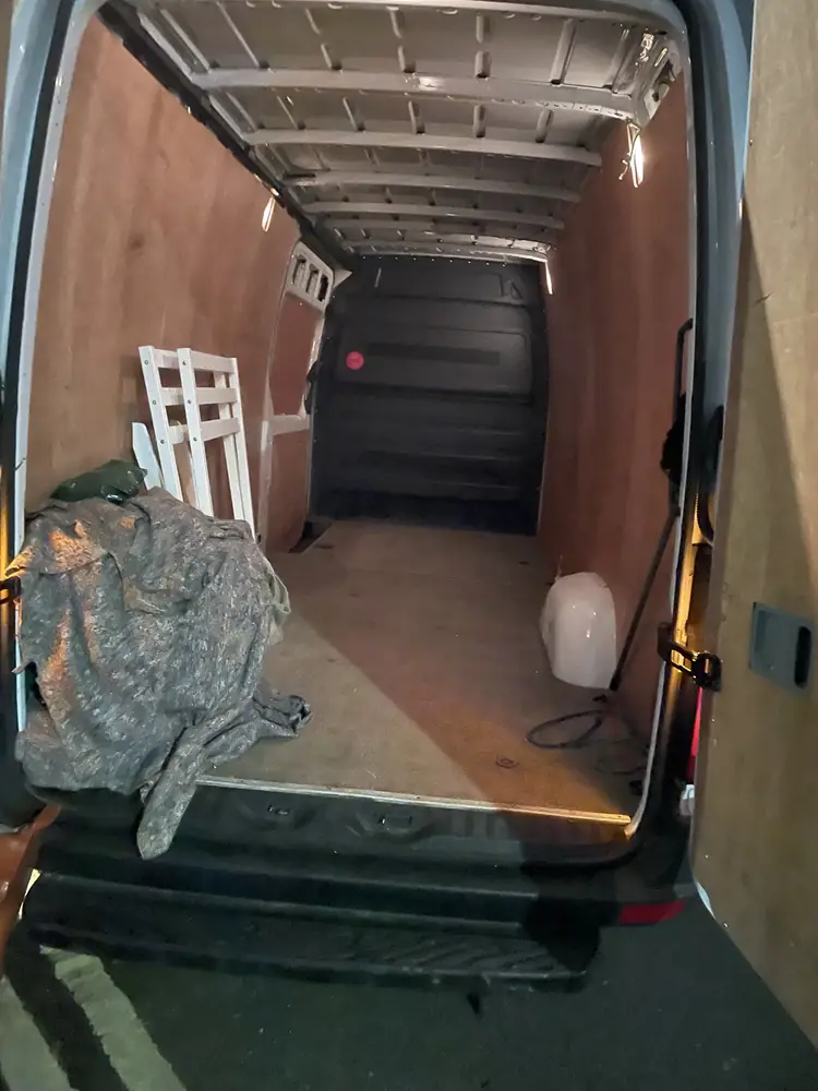 Empty van lined with moving blankets before loading
