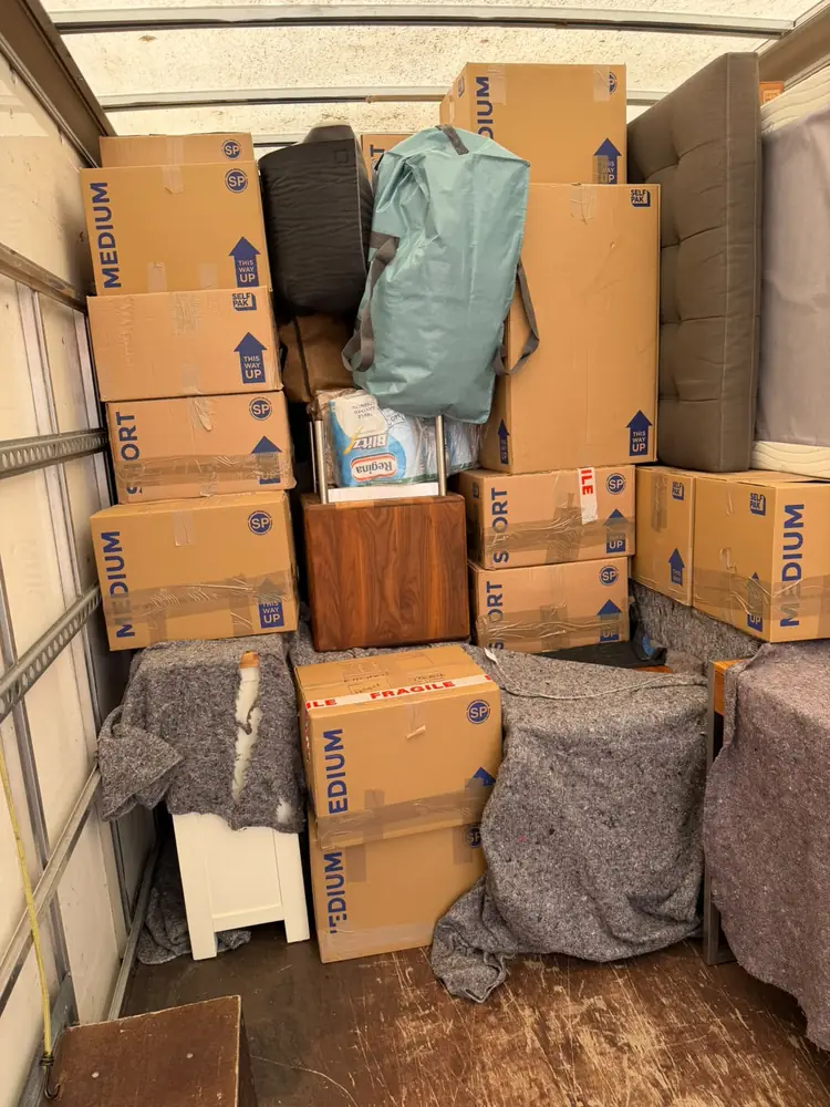 Boxes and blankets loaded in the van