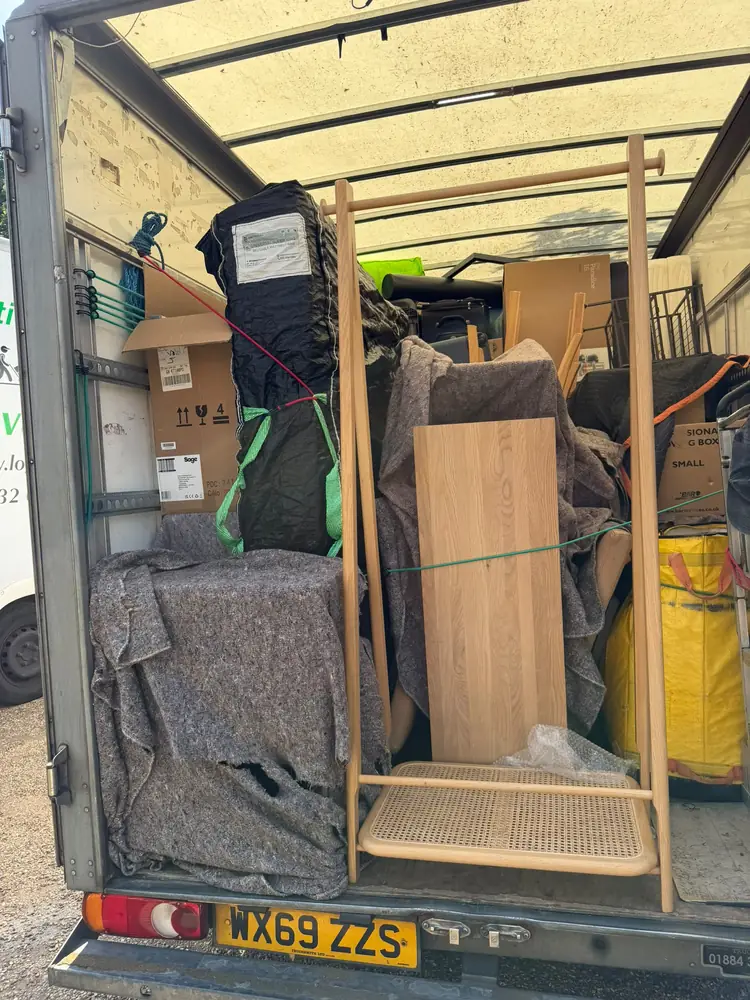 Boxes and wrapped furniture loaded in the van