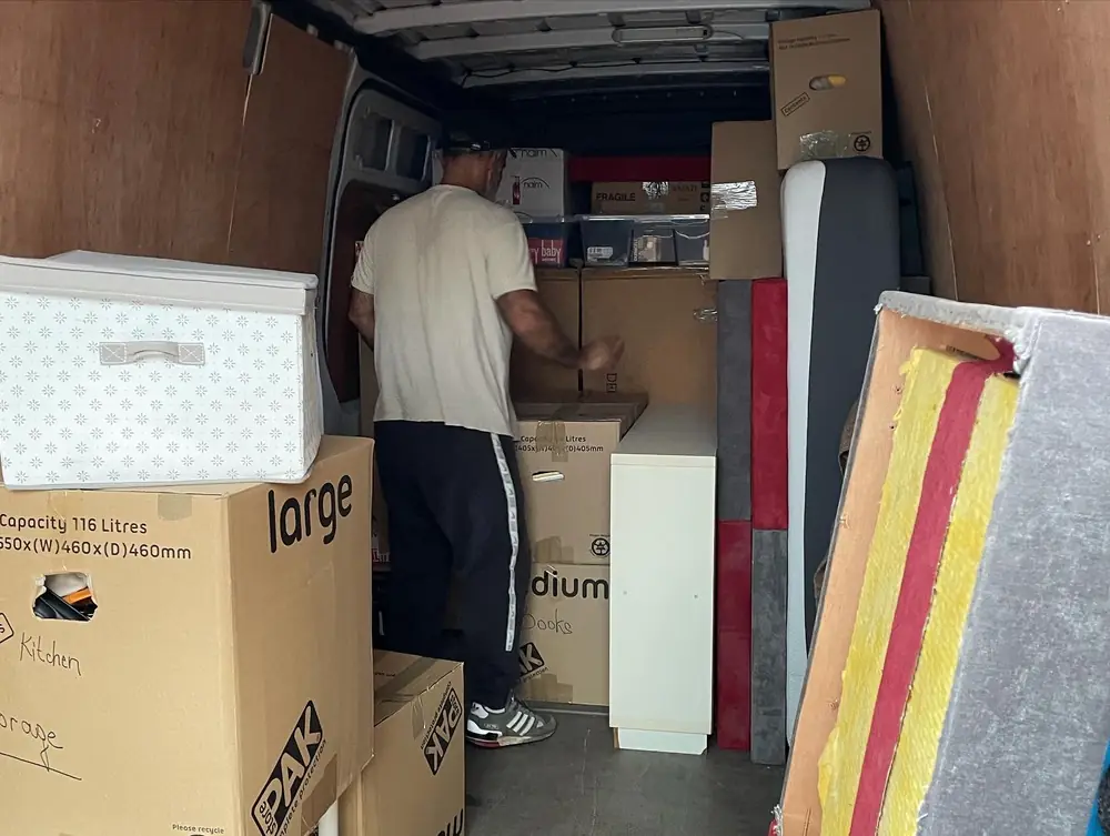 Team stacking boxes in the van
