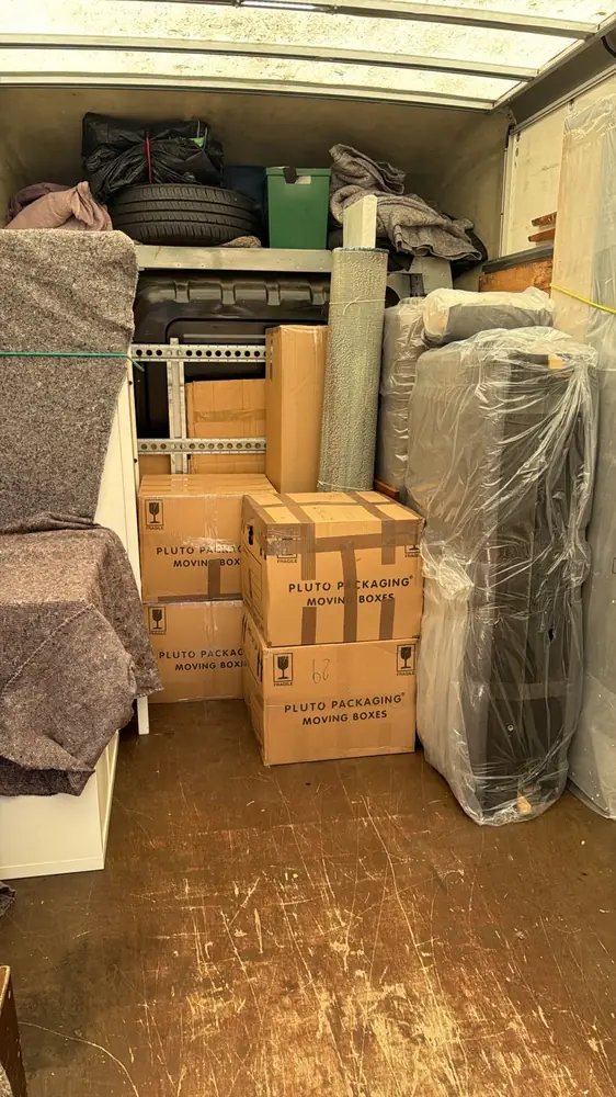 Neatly wrapped furniture and boxes in the van