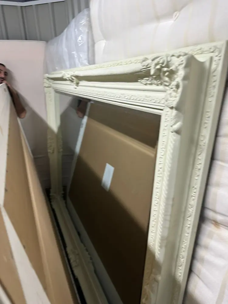 Ornate mirror protected for transport